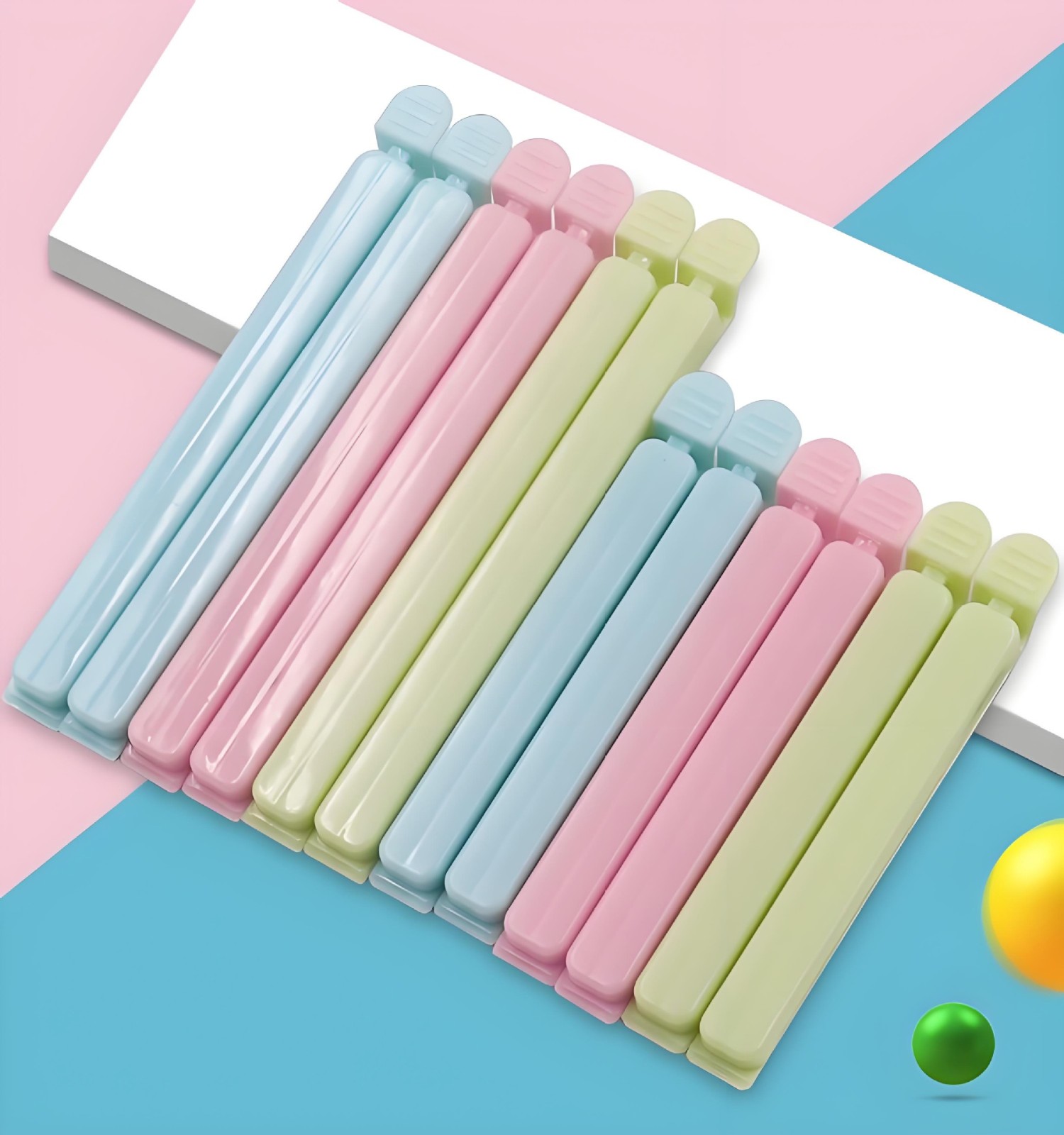 Small pink eco - friendly plastic bag clips with super - strong clamping force, which can keep food fresh for longer. A must - have kitchen gadget.